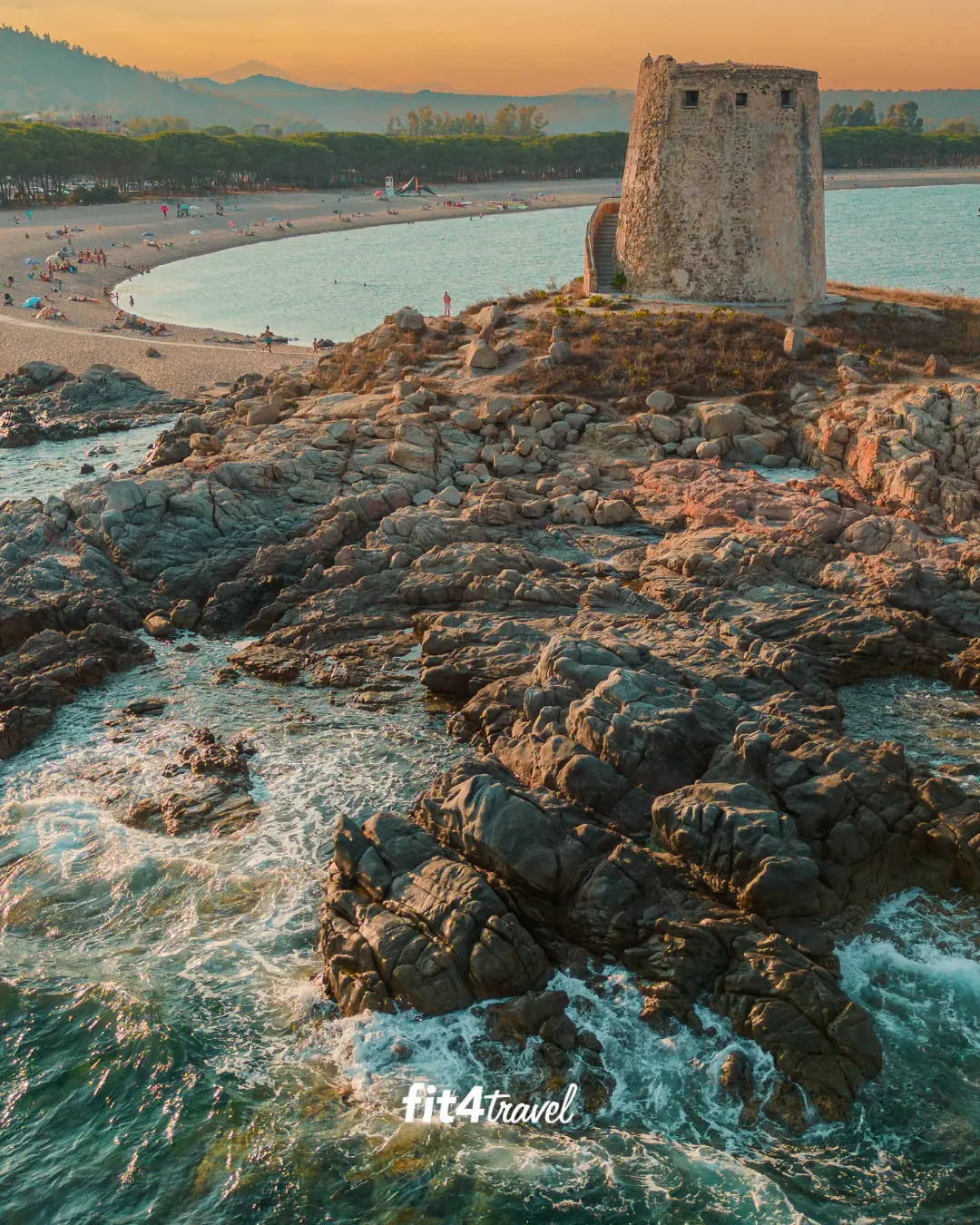 The Torre di Bari watchtower on rocky coastline at golden hour