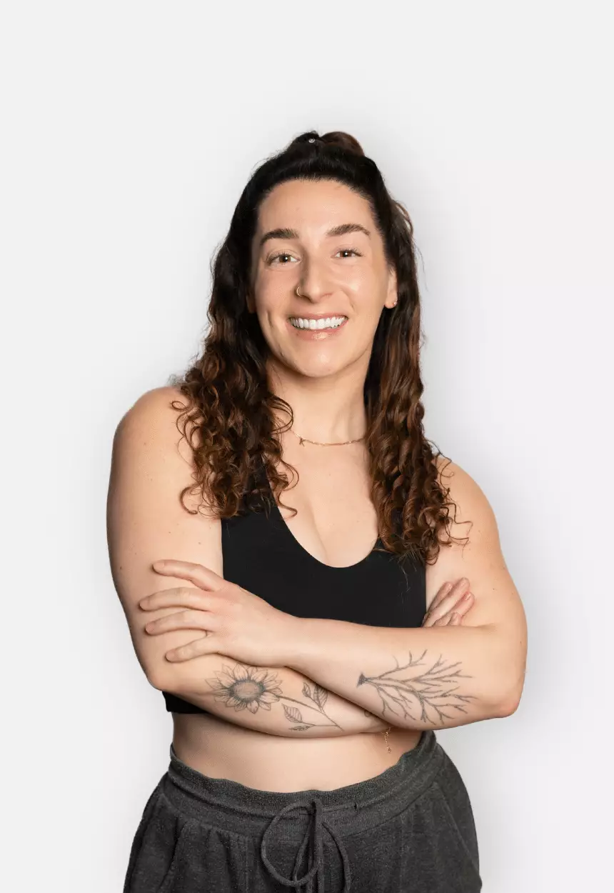 Kellie Spencer smiling with arms crossed